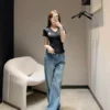 Louis Vuitton Denim High-Waist Logo Jeans