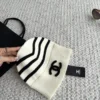 Chanel Black and White Striped Knitted Beanie with Raised CC Embroidery - Ref. HTCHANEL0008