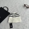 Chanel Black and White Striped Knitted Beanie with Raised CC Embroidery - Ref. HTCHANEL0008