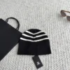 Chanel Black and White Striped Knitted Beanie with Raised CC Embroidery - Ref. HTCHANEL0009