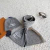 Louis Vuitton Ribbed Knitted Hat and Scarf Set with Script-Style Embroidery